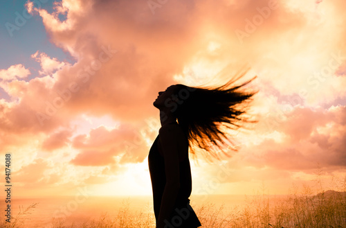 Woman feeling free in a beautiful natural setting.