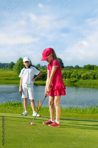 Kids playing golf