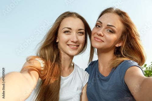 Two beautiful girls making selfie