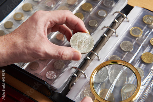 American dollar in hands of numismatist