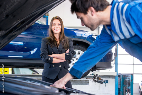 Car owner happy with instant service by a professional mechanic
