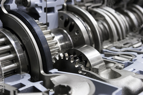 Gearbox cross-section, automotive transmission with sprocket and bearing mechanism for commercial trucks, SUV, cargo, and construction vehicles, selective focus