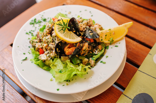 traditional slovenian cuisine, seafood salad with fresh mussels, selective focus