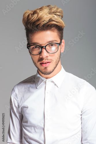 handsome student wearing frames while posing in studio