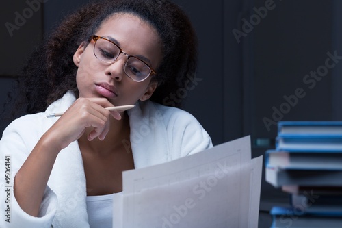 Black girl reading a document