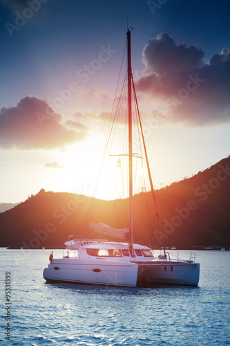 Beautiful view to catamaran in Seychelles bay at sunset