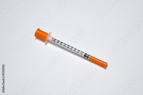 single insulin syringe isolated on white