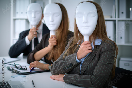 Group of business people at meeting. Business people hide their emotions under the mask of confidence during the negotiations , business concept