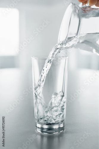 Drink Water. Pouring Water From Pitcher Into Glass. Health, Diet