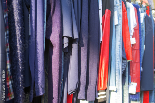 Clothes for sale in a street market. Color image