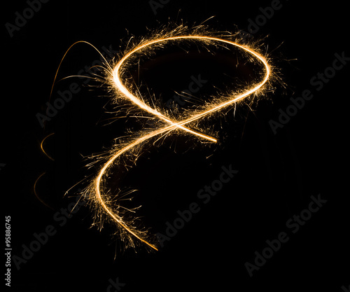 sparkler light trail in dark environment using slow shutter speed