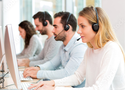 Young attractive woman working in a call center