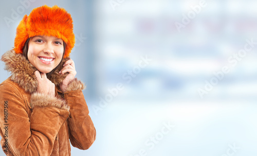Young woman wearing winter coat.