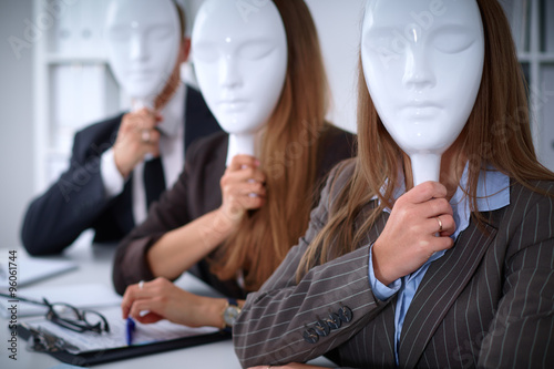 Group of business people at meeting. Business people hide their emotions under the mask of confidence during the negotiations , business concept