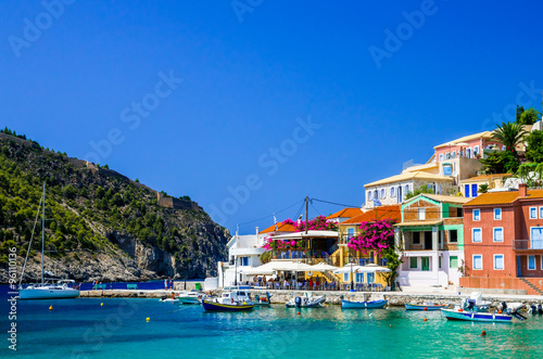 ASSOS TOWN, KEFALONIA ISLAND, GREECE - JULY 12, 2015: Bay of Assos with boats and yachts. Assos village on the Island of Kefalonia in Greece.