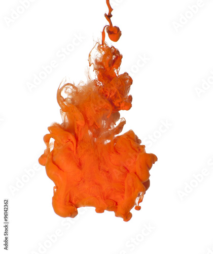 Abstraction of orange acrylic paint in water..