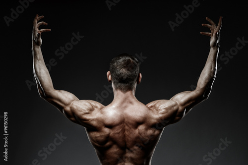 bodybuilder posing and turned his back