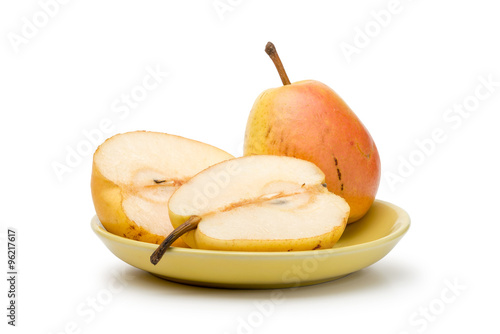 Two yellow and red juicy duchess pears in a yellow plate, isolated on white background