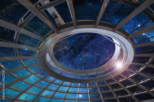 glass dome of astronomical observatory under a starry sky
