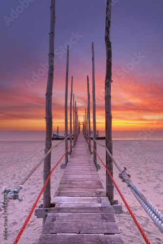 Seaside jetty at sunrise on Texel island, The Netherlands