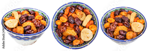 set of traditional ceramic bowls with dried fruits