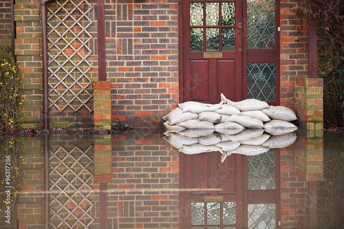 Sandbags Outside Front Door Of Flooded House