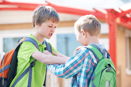 Two Boys Fighting In School Playground