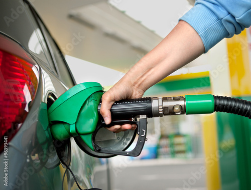 a Arm Refueling the Car at a Gas Station