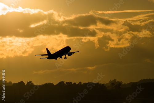 Silhouette plane take off in morning
