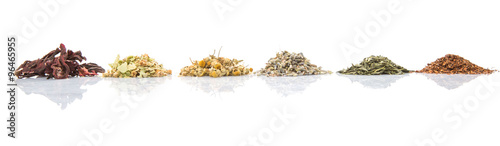 Dried herbal tea leaves, lavender, rooibos, chamomile, linden flower, hibiscus, Japanese green tea over white background