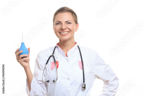 Happy female doctor holding enema
