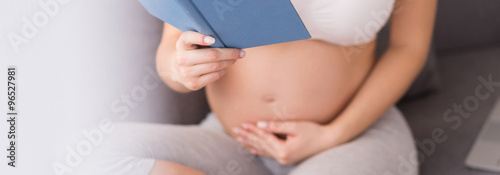 Pregnant woman reading book