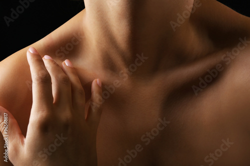 View on woman's neck, collarbone and shoulders, close-up