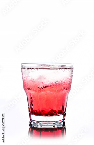 Delicious pomegranate cocktail on the white background