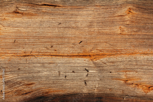 old wooden board with holes left by staples