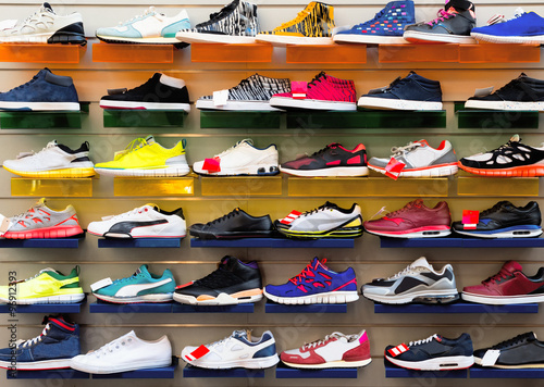 Big collection of different sport shoes.