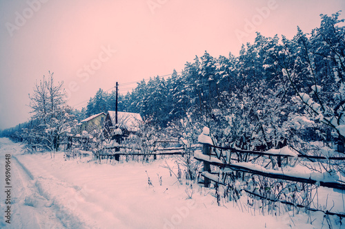 Snowy winter rural landscape at sunset