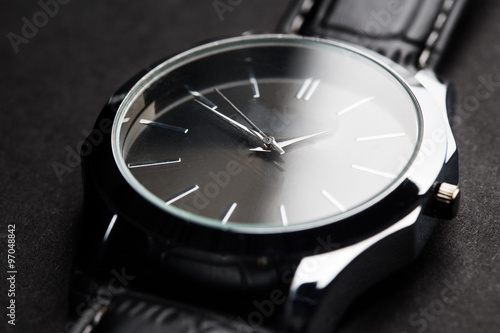 close up of black classic male wristwatch