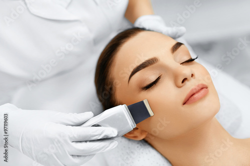 Skin Care. Close-up Of Beautiful Woman Receiving Ultrasound Cavitation Facial Peeling. Ultrasonic Skin Cleansing Procedure. Beauty Treatment. Cosmetology. Beauty Spa Salon.