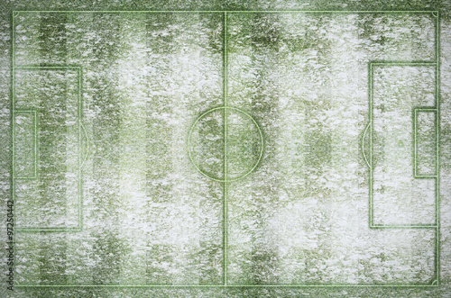 Green football stadium and field in winter snow