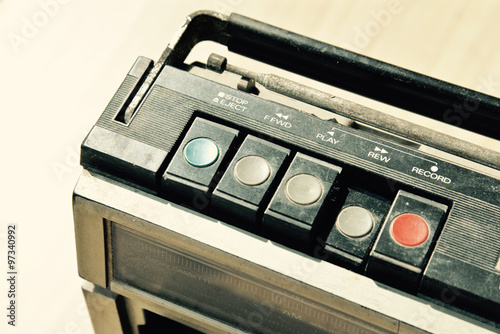 Dusty old radio with one cassette player, press rewind