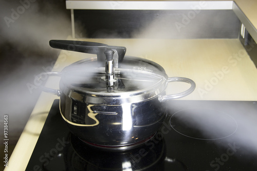Pressure cooker releasing hot steam