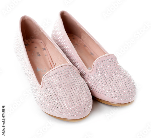 Girl shiny pink shoes isolated on white background