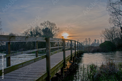 Footbridge over a flooded River Test near Stockbridge in the Test valley, Hampshire, England.