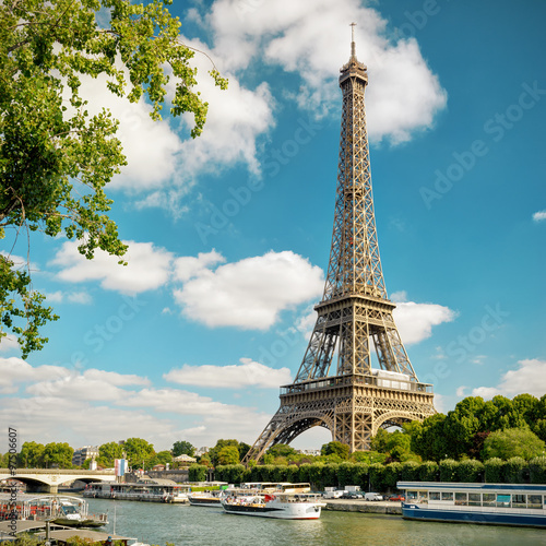 Eiffel Tower and blue sky, Paris, France. View of Seine river in summer.