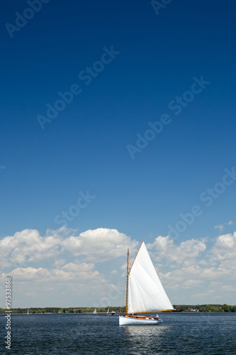 Single Sailboat as viewed on a beautiful Spring day from the Chesapeake Bay Maritime Museum in Saint Michael's, Maryland.