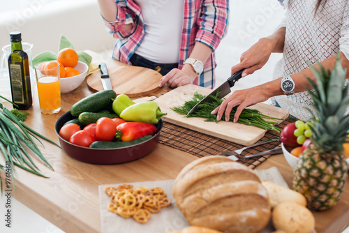 Gorgeous young Women preparing dinner in a kitchen concept cooking, culinary, healthy lifestyle