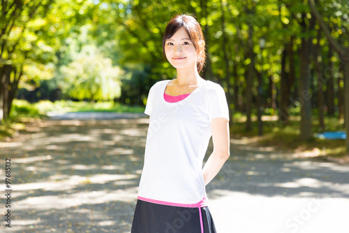 young asian woman jogging image