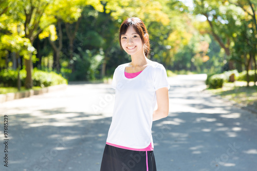young asian woman jogging image