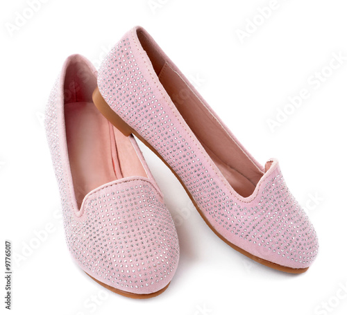Girl shiny pink shoes isolated on white background